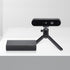 Front view of Orbbec Gemini 2 XL 3D camera on a mini tripod placed alongside the sleek black OBox PoE adapter.