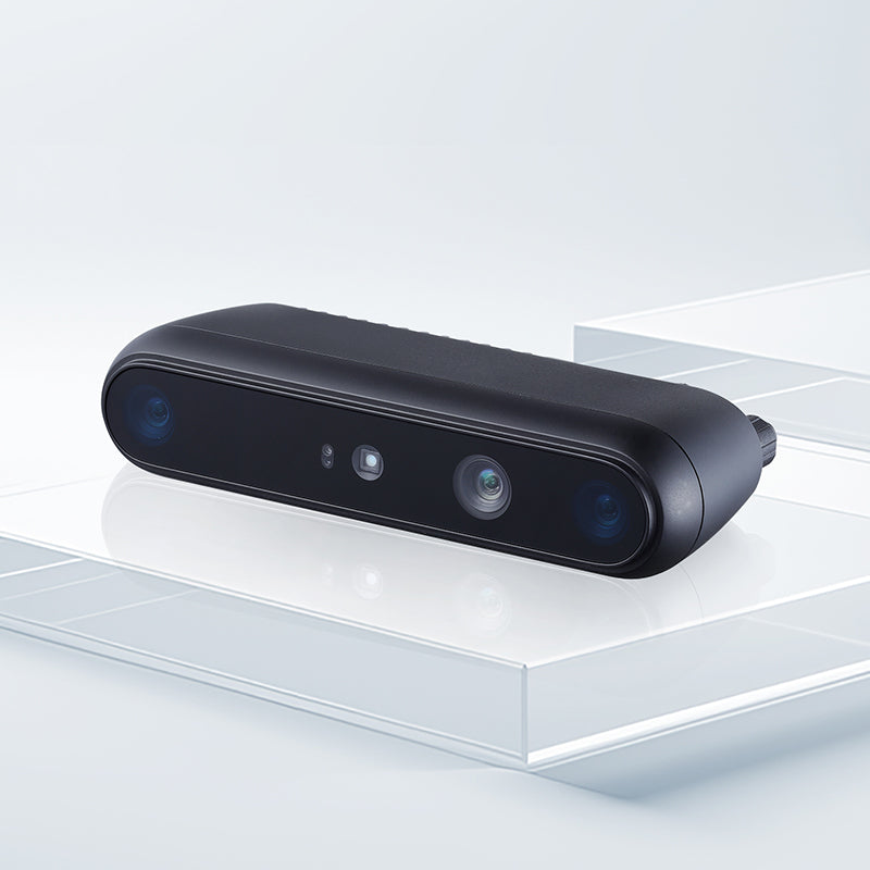 Angled promotional view of Gemini 335LE 3D camera showcasing its compact protective enclosure for factory automation.